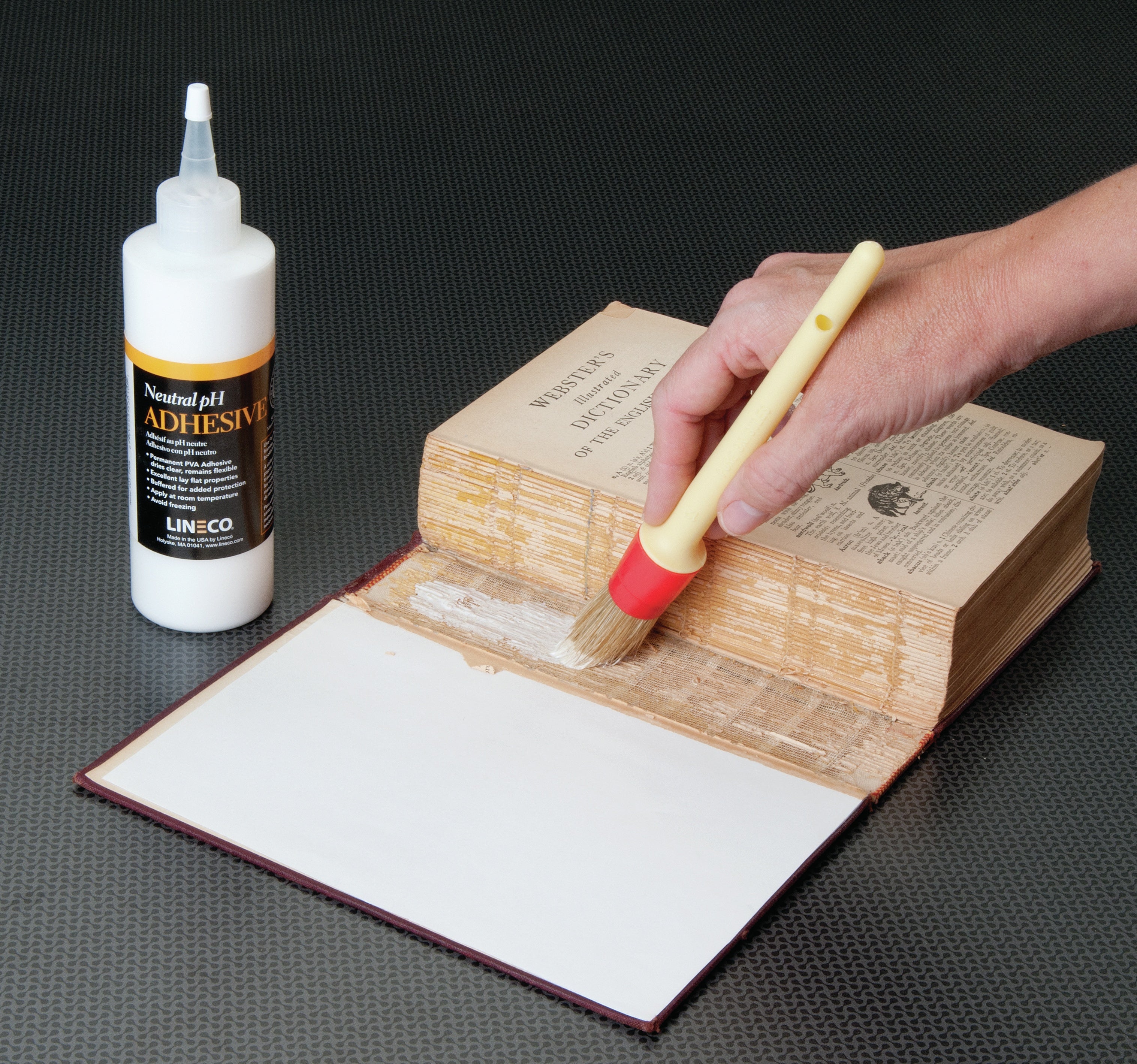 Lineco - PH neutral adhesive used for bookbinding, crafts and other fine art application.
